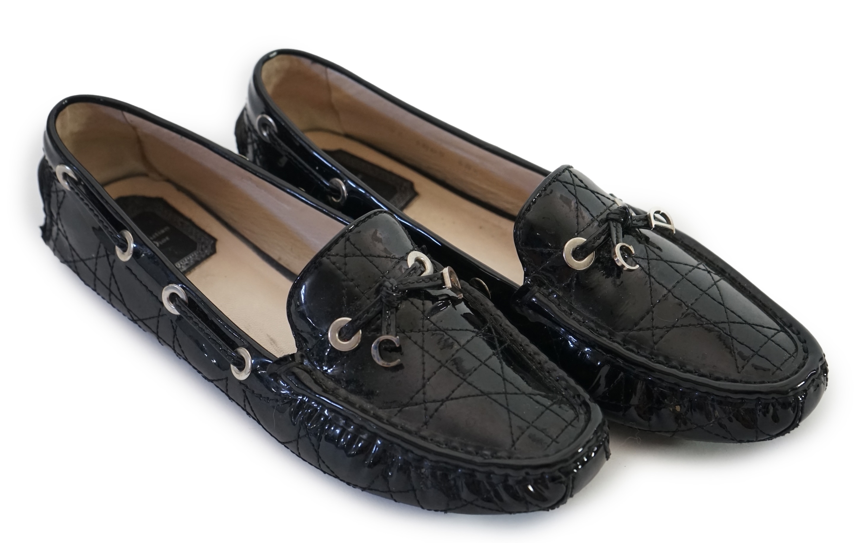 A pair of Christian Dior black patient leather lady's driving shoes with dustbag and in original box. Size 38.5. Proceeds to Happy Paws Puppy Rescue